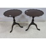 A PAIR OF GEORGIAN DESIGN MAHOGANY WINE TABLES each with a pie crust rim above a baluster column on