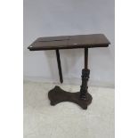 A 19TH CENTURY MAHOGANY TELESCOPIC BED TABLE with reading slope