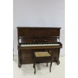 A HILTON AND HILTON MAHOGANY CASE UPRIGHT PIANO steel frame raised on square tapering front