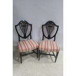 A PAIR OF GEORGIAN MAHOGANY SHIELD BACK DINING CHAIRS each with a pierced vertical splat and