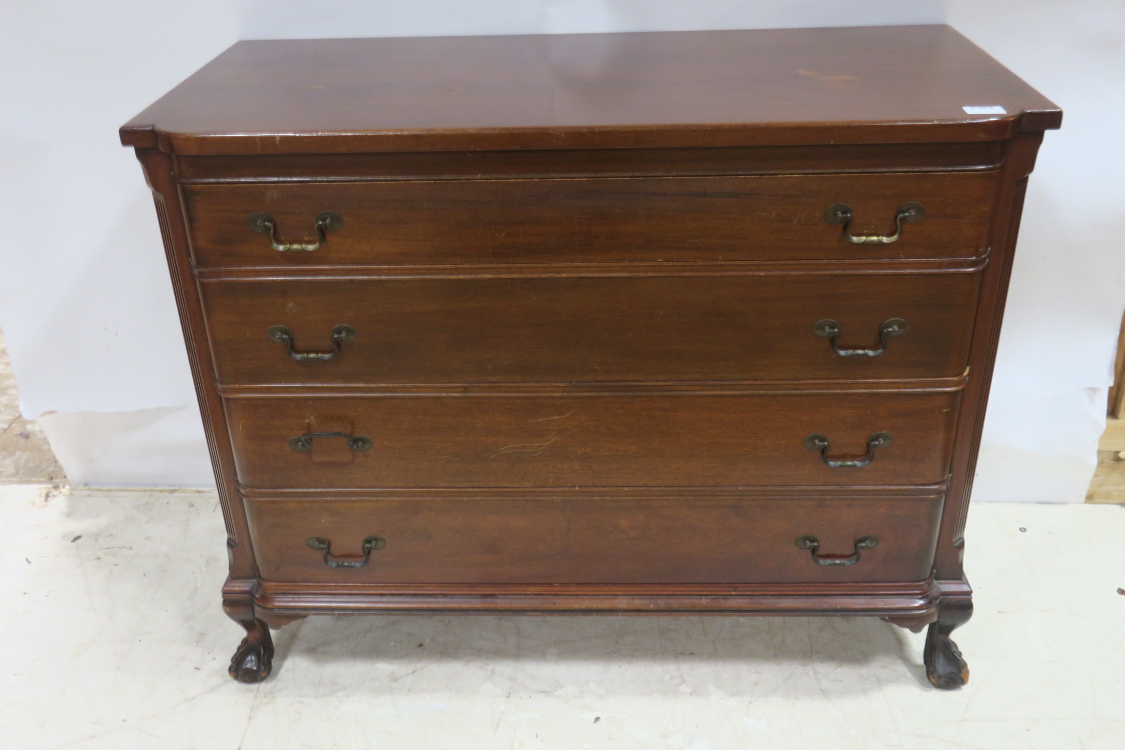 A GEORGIAN DESIGN MAHOGANY CHEST of rectangular bowed outline the shaped top above four long