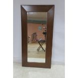 A CHERRYWOOD MIRROR of rectangular outline with bevelled glass plate 200cm x 100cm