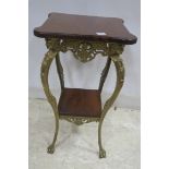 A CONTINENTAL GILT BRASS MAHOGANY JARDINIERE TABLE the shaped moulded top raised on a gilt brass