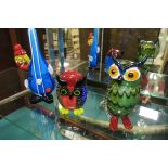 THREE MULTICOLOURED GLASS ORNAMENTS modelled as two owls and a clown with a cello