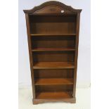 A MAHOGANY FIVE TIER OPEN FRONT BOOKCASE with adjustable shelves between reeded pilasters on