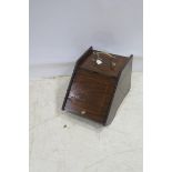 A 19TH CENTURY MAHOGANY AND SATINWOOD INLAID SLOPE FRONT FUEL BIN with liner on moulded base with