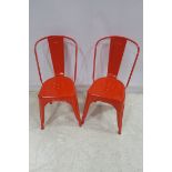 A SET OF TEN RED TOLEX CHAIRS each with an arched top rail and solid splat with shaped seats on