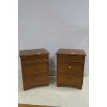 A PAIR OF ROSSMORE TEAK THREE DRAWER BEDSIDE CHESTS 74cm (h) x 56cm (w) x 42cm (d)