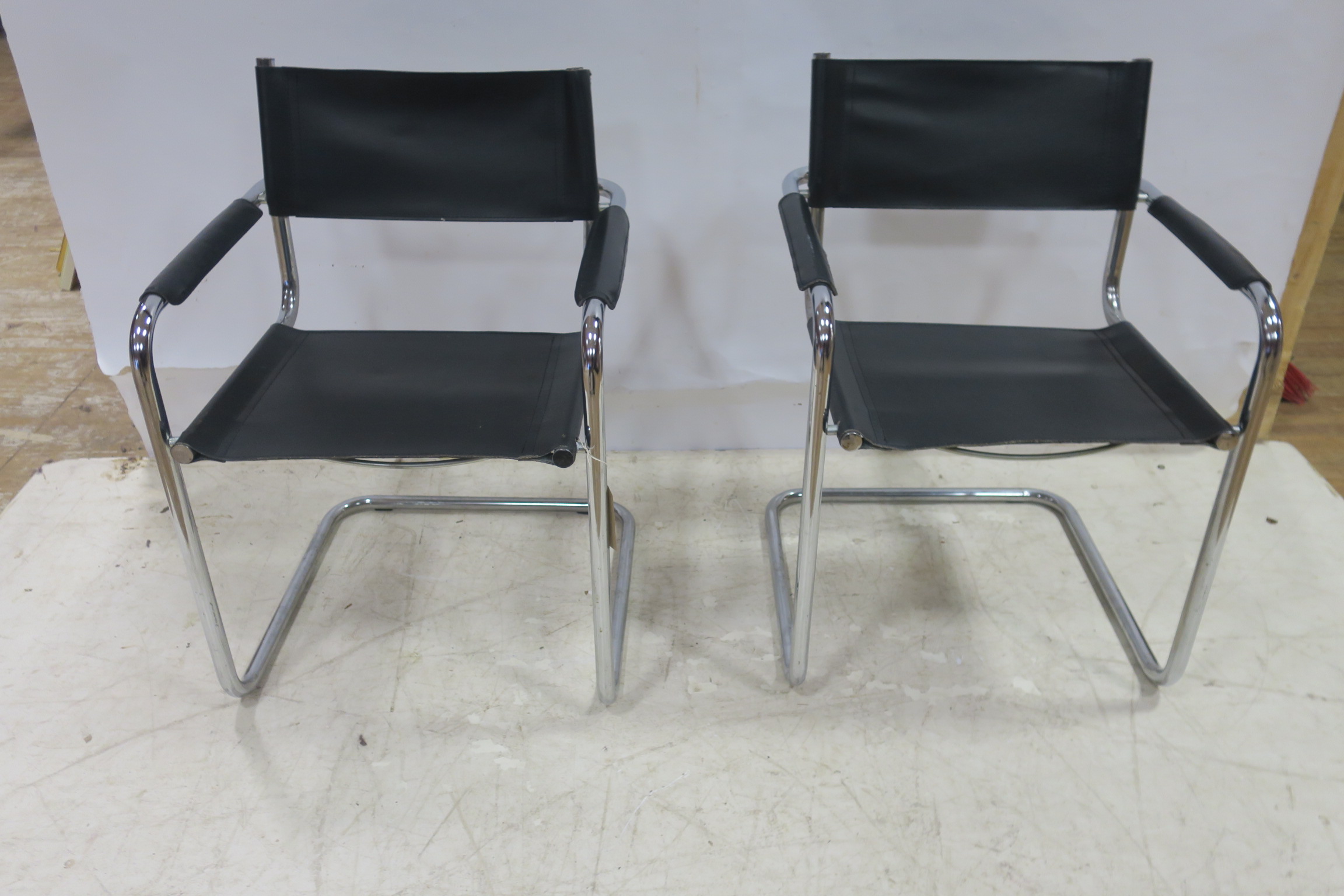 A PAIR OF MART-STAM S-3-4 VINTAGE CHAIRS each with a chrome frame and hide splat and seat