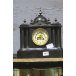 A 19TH CENTURY BLACK SLATE MANTLE CLOCK of rectangular outline with white enamel dial and Roman