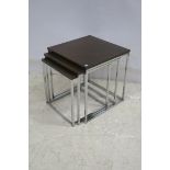 A NEST OF THREE TEAK AND CHROME TABLES CIRCA 1960 each of rectangular outline on square moulded