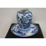 AN ORIENTAL BLUE AND WHITE VASE of baluster form decorated with flower heads and foliage together
