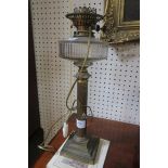 EARLY 20TH CENTURY BRASS COLUMNAR OIL LAMP electrified with clear glass reservoir 51cm (h)