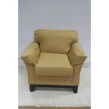 A PAIR OF CANADIAN STAINED WOOD AND GOLD UPHOLSTERED ARM CHAIRS with curved arms and loose cushions