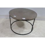 A BLACK METAL AND BRASS TABLE of circular outline on tubular base 40cm x 61cm