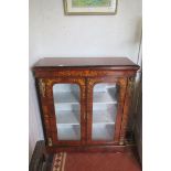 A FINE 19TH CENTURY KINGWOOD AND MAHOGANY DISPLAY CABINET of rectangular outline the shaped top