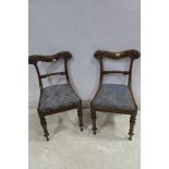 A PAIR OF 19TH CENTURY MAHOGANY SIDE CHAIRS each with a carved top rail and splat with upholstered