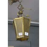 A BRASS AND GLAZED CENTRE LIGHT of rectangular tapering form