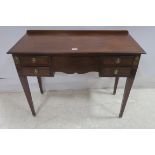 A 19TH CENTURY MAHOGANY AND SATINWOOD INLAID SIDE TABLE of rectangular outline the shaped top above