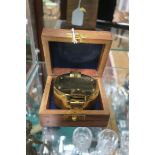 A BRASS COMPASS in hardwood case