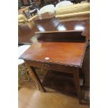 A MAHOGANY SIDE TABLE of rectangular outline the shaped top with moulded back above frieze drawer