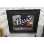 A VINTAGE PUB MIRROR inscribed Bass in bottle engraved Bass and Company Ltd in an oak frame 69cm