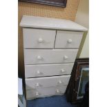 A PINE GREY PAINTED CHEST the rectangular top above two short and four long drawers on shaped