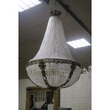 A VERY FINE AND IMPRESSIVE CONTINENTAL GILT BRASS AND CUT GLASS TEN LIGHT BASKET CHANDELIER hung