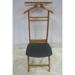 A BEECHWOOD AND UPHOLSTERED GENTLEMAN'S VALET CHAIR on x shape support