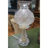 A WATERFORD HOBNAIL CUT GLASS TABLE LAMP the bulbous shade above a baluster column on circular foot
