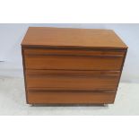 A CIRCA 1960s TEAK CHEST of three long drawers on castors 68cm (h) x 85cm (w) x 47cm (d) THE