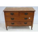 A STAINED BEECHWOOD CHEST of two short and two long drawers on turned legs 80cm (h) x 106cm (w) x