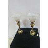 A PAIR OF GILT BRASS AND FROSTED GLASS TABLE LAMPS each with a cylindrical column on circular foot