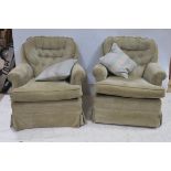 A PAIR OF TUB SHAPED EASY CHAIRS each with deep buttoned upholstered back and loose cushion with