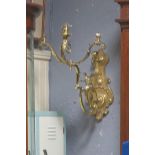 A 19th CENTURY CAST BRASS THREE BRANCH WALL LIGHT with foliate scroll arms and cartouche back plate