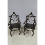 A PAIR OF SIMULATED ANTLER CHAIRS each with panelled seat on shaped legs