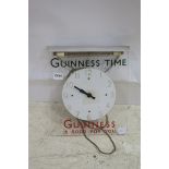 A PERSPEX AND CHROME WALL MOUNTED CLOCK inscribed Guinness Time Guinness is Good For You with strip