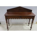 A 19TH CENTURY MAHOGANY SIDE TABLE the rectangular top with moulded back and shaped frieze on