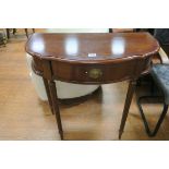 A HEPPLEWHITE DESIGN MAHOGANY CROSS BANDED SIDE TABLE of demi lune outline with frieze drawer on