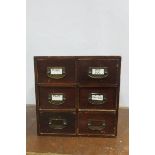 A STAINED WOOD SIX DRAWER DESK TOP FILING UNIT with brass drop handles 39cm (h) x 39cm (w) x 32cm