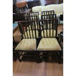 A SET OF SIX 19TH CENTURY OAK DINING CHAIRS each with a curved top rail and pierced vertical splats