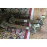 TWO PAIRS OF BRASS BALL AND CLAW FEET joined by a steel stretcher 20cm (h) x 56cm (l)