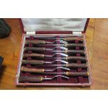 A CASE SET OF TWELVE STEAK KNIVES AND FORKS together with plated ice bucket cutlery etc