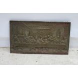 A CAST IRON PLAQUE depicting the last supper 36cm x 63cm