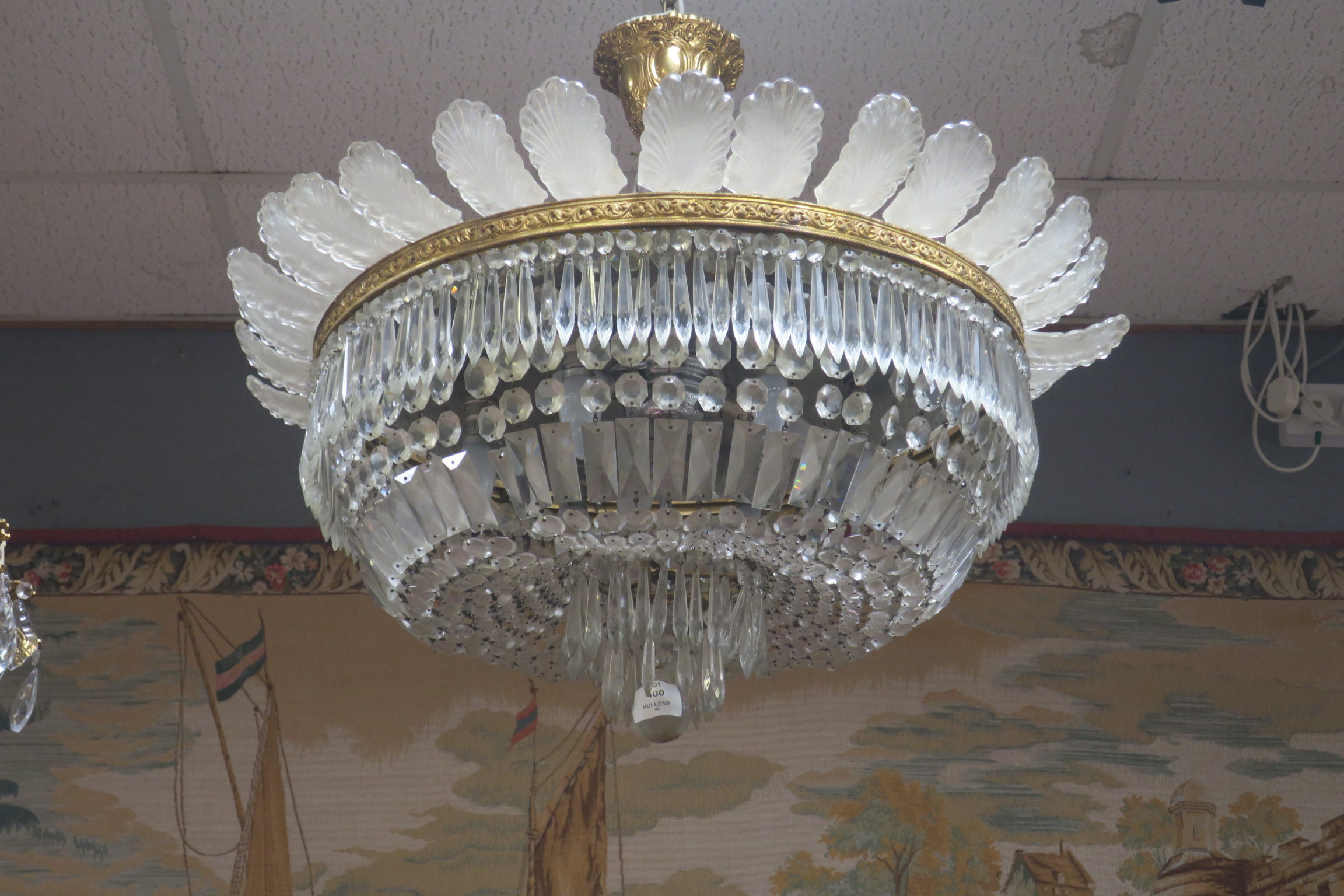 A FINE CONTINENTAL GILT BRASS AND CUT GLASS BASKET CHANDELIER hung with faceted chains and drops