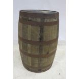 A PAIR OF OAK AND STEEL BOUND BARRELS of typical form 90cm (h) x 50cm (d) THE BUYER OF THIS LOT