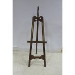 A STAINED WOOD AND BRASS ADJUSTABLE EASEL 176cm (h)