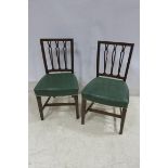 A SET OF SIX 19TH CENTURY MAHOGANY DINING CHAIRS each with a curved top rail and pierced vertical