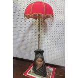A COMPOSITION POLYCHROME AND BRASS FIGURAL TABLE LAMP with spiral twist column and shade 92cm (h)