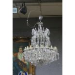 A VERY FINE CONTINENTAL SIXTEEN BRANCH CHANDELIER hung with faceted pendants